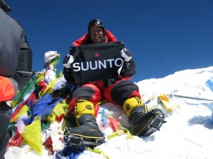 Apa Sherpa on summit of Mt. Everest whipping out the Suunto banner. Photo: Apa Sherpa Foundation.