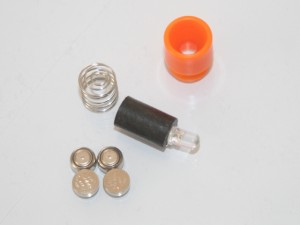 The LED light uses four button-sized batteries.  